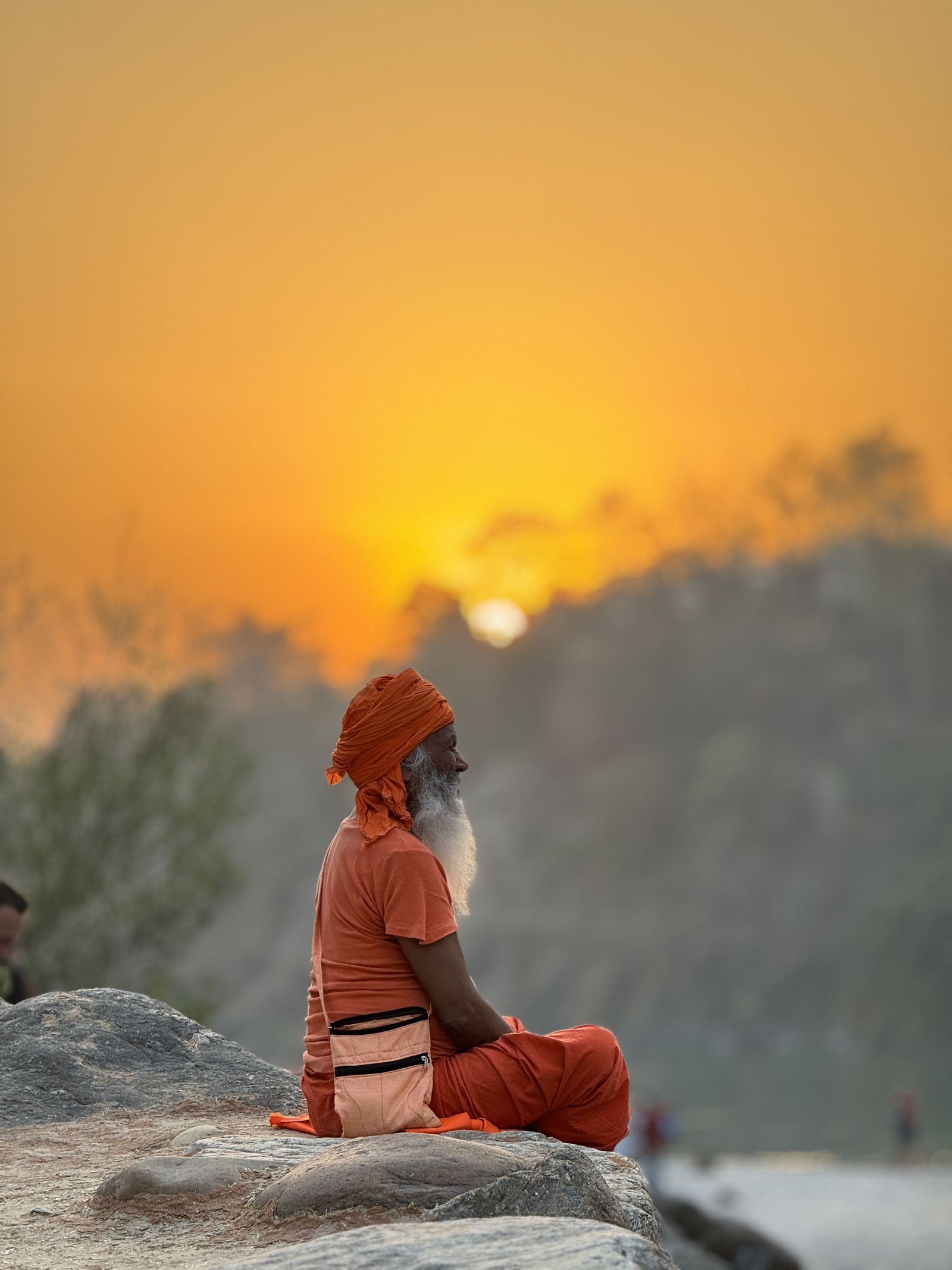 Portrait of a sadhu meditating at sunset